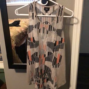 Cute summer top. See through, so you need an under bottom. Opening on the sides.